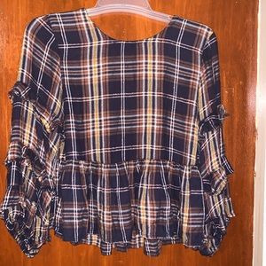 Dizzylissy long sleeve plaid print shirt. Ruffle accents